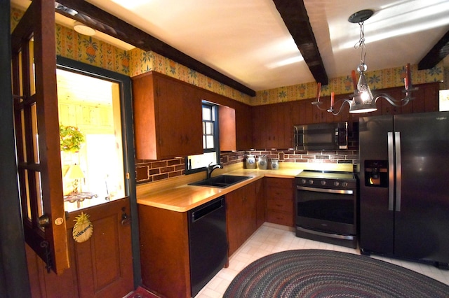 2645 Riverside Ln NE, Rochester, MN 55906 - kitchen featuring stainless steel appliances, a sink, light countertops, backsplash, and a chandelier