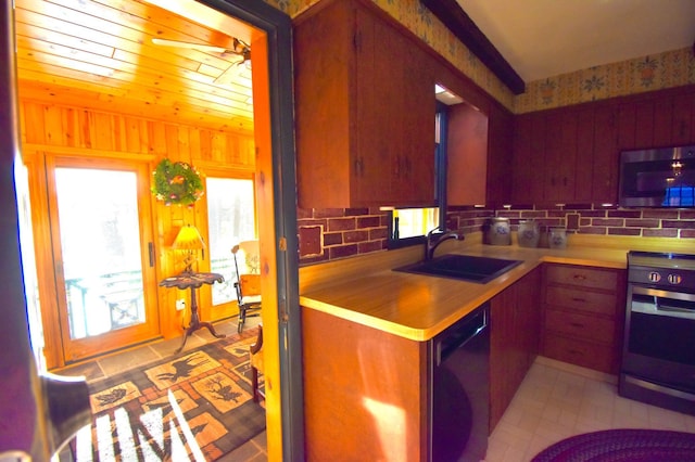 2645 Riverside Ln NE, Rochester, MN 55906 - kitchen with stainless steel microwave, dishwashing machine, a sink, oven, and backsplash