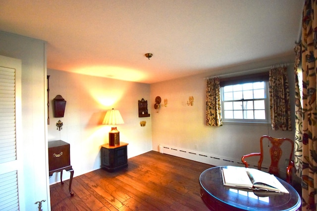 2645 Riverside Ln NE, Rochester, MN 55906 - living area featuring hardwood / wood-style flooring and a baseboard radiator