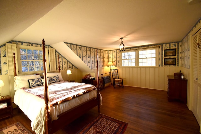 2645 Riverside Ln NE, Rochester, MN 55906 - bedroom featuring wallpapered walls, wood finished floors, and a closet