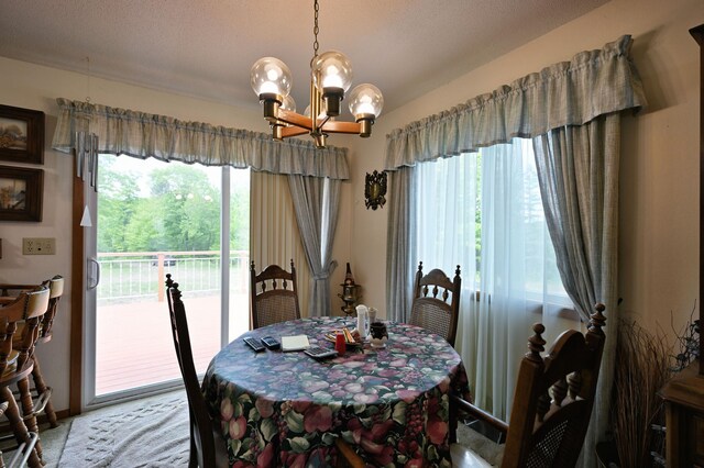 27681 Moser Dr, Jackson Twp, WI 54893 - dining area with a chandelier and light carpet
