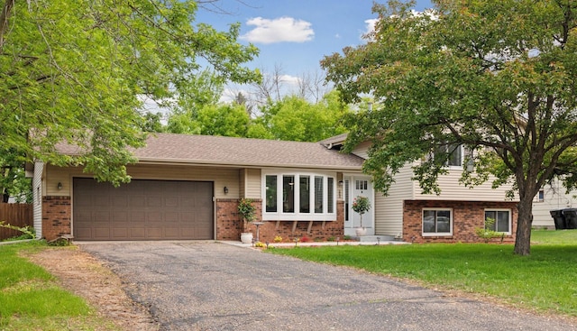 265 107th Ln NW, Coon Rapids, MN 55448 - split level home featuring brick siding, an attached garage, driveway, and a front lawn