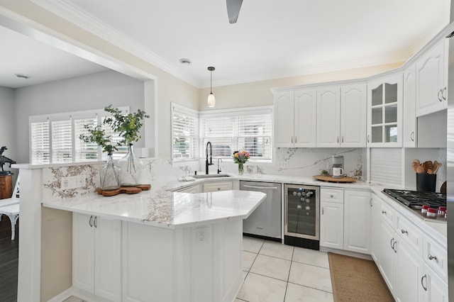 5035 Wren Rd, Mound, MN 55364 - kitchen featuring beverage cooler, appliances with stainless steel finishes, a sink, a peninsula, and white cabinetry