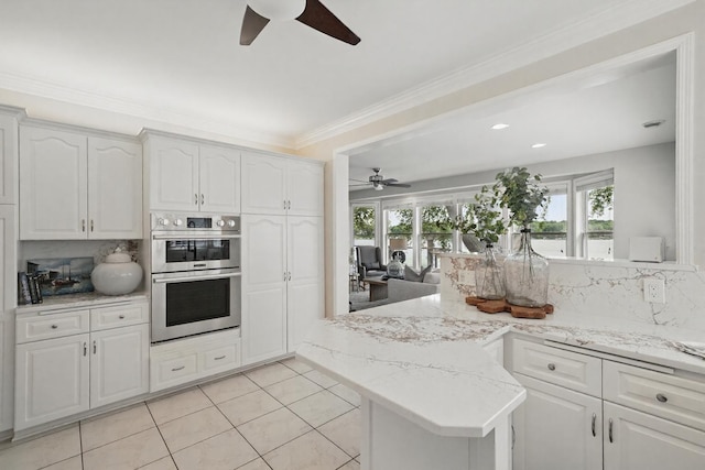5035 Wren Rd, Mound, MN 55364 - kitchen featuring ceiling fan, double oven, a peninsula, healthy amount of natural light, and ornamental molding