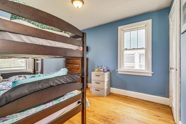 1167 Geranium Ave E, Saint Paul, MN 55106 - bedroom featuring hardwood / wood-style floors and baseboards