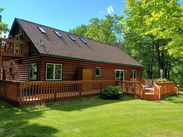 29805 Arbo Rd, Grand Rapids, MN 55744 - back of property with roof with shingles, a yard, and a wooden deck