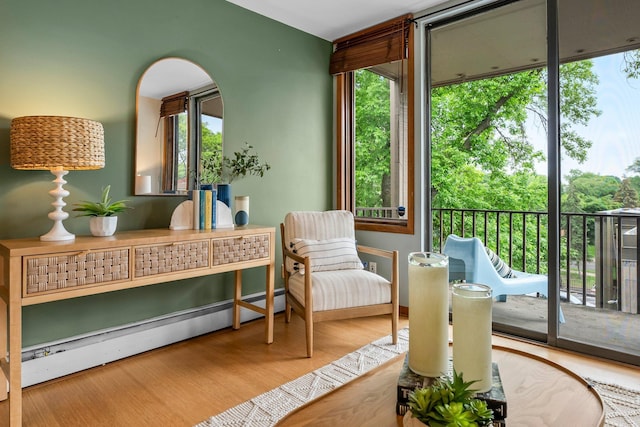 1405 40th St Unit 15F, Minneapolis, MN 55407 - sitting room with plenty of natural light, wood finished floors, and baseboard heating