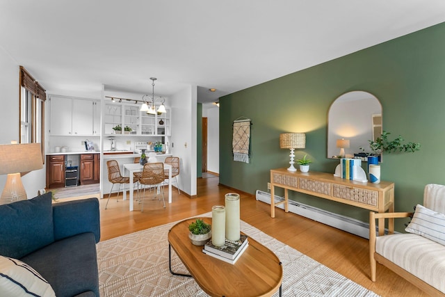 1405 40th St Unit 15F, Minneapolis, MN 55407 - living area with light wood finished floors and a baseboard radiator
