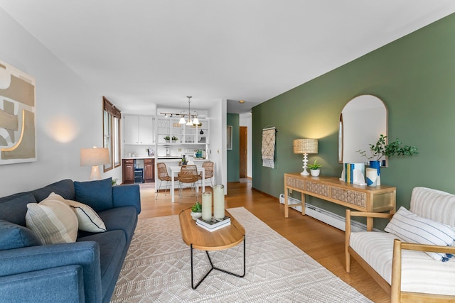 1405 40th St Unit 15F, Minneapolis, MN 55407 - living area with a chandelier and light wood finished floors