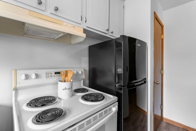 1405 40th St Unit 15F, Minneapolis, MN 55407 - kitchen featuring electric range, range hood, freestanding refrigerator, wood finished floors, and white cabinets