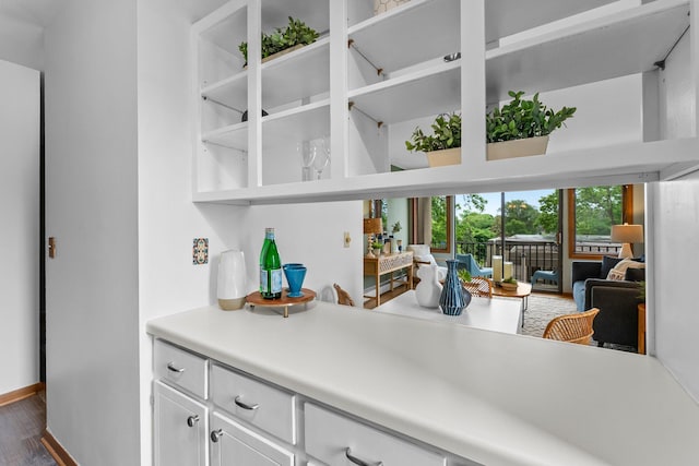 1405 40th St Unit 15F, Minneapolis, MN 55407 - bar with dark wood-style floors and baseboards
