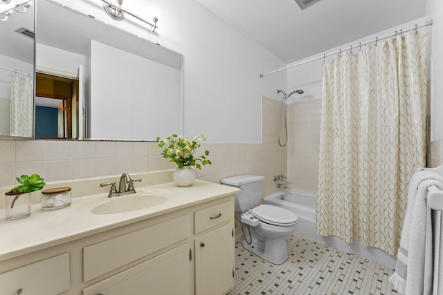 1405 40th St Unit 15F, Minneapolis, MN 55407 - bathroom featuring tile walls, vanity, toilet, shower / bath combination with curtain, and tile patterned floors
