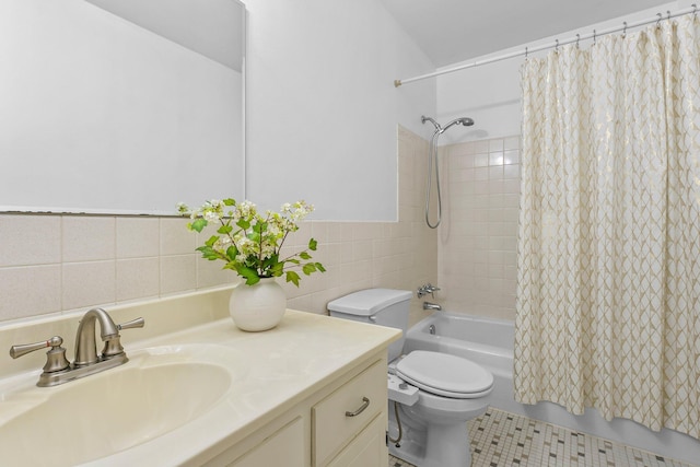 1405 40th St Unit 15F, Minneapolis, MN 55407 - bathroom featuring toilet, vanity, shower / bath combo with shower curtain, tile patterned flooring, and tile walls