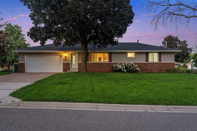6540 Zealand Ave N, Brooklyn Park, MN 55428 - ranch-style house featuring brick siding, a garage, concrete driveway, and a lawn