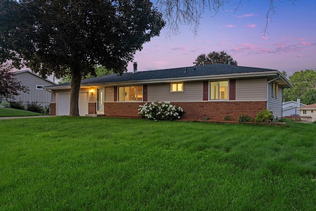 6540 Zealand Ave N, Brooklyn Park, MN 55428 - ranch-style house featuring brick siding, a garage, a front yard, and a chimney