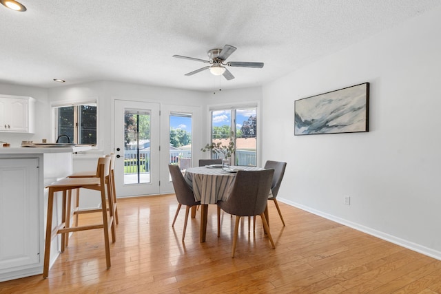 6540 Zealand Ave N, Brooklyn Park, MN 55428 - dining space with a textured ceiling, a ceiling fan, light wood-style flooring, and recessed lighting