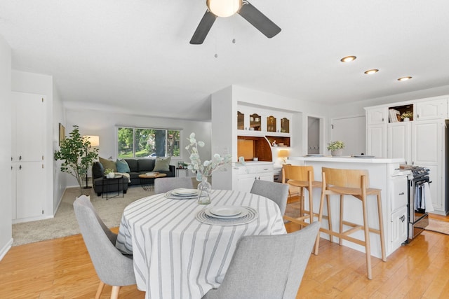 6540 Zealand Ave N, Brooklyn Park, MN 55428 - dining space featuring light wood finished floors, a ceiling fan, and recessed lighting