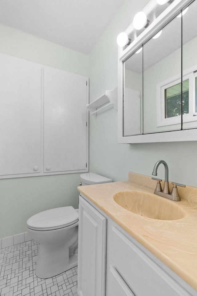 6540 Zealand Ave N, Brooklyn Park, MN 55428 - bathroom featuring toilet and vanity