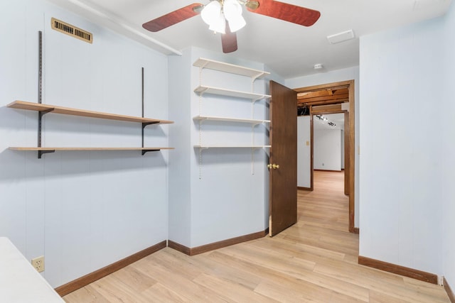 6540 Zealand Ave N, Brooklyn Park, MN 55428 - walk in closet with light wood-type flooring and a ceiling fan