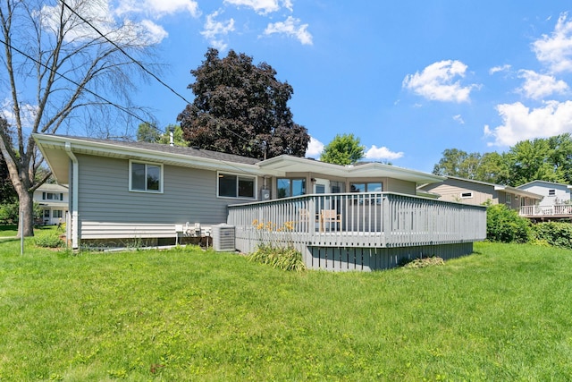 6540 Zealand Ave N, Brooklyn Park, MN 55428 - back of house with a deck and a lawn