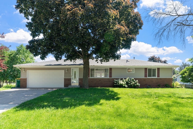 6540 Zealand Ave N, Brooklyn Park, MN 55428 - ranch-style home featuring brick siding, a garage, driveway, and a front yard