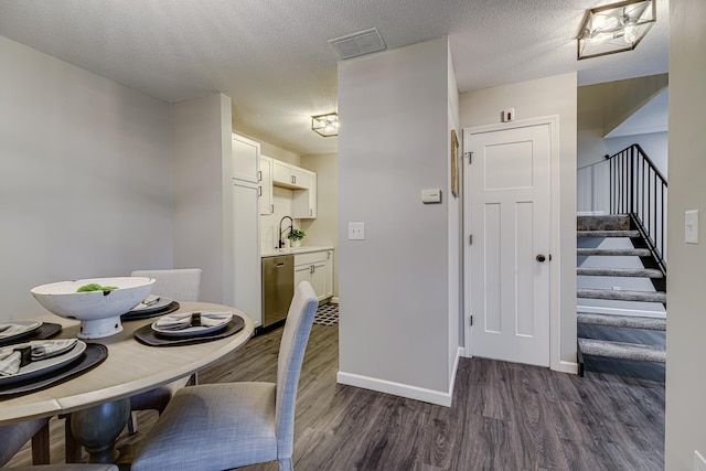 1034 Carmel Ct, Shoreview, MN 55126 - dining space featuring dark wood-type flooring, stairs, baseboards, and a textured ceiling