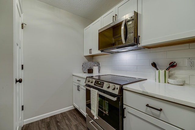 1034 Carmel Ct, Shoreview, MN 55126 - kitchen featuring stainless steel appliances, backsplash, dark wood-type flooring, white cabinetry, and a textured ceiling