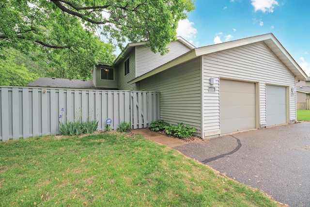 1034 Carmel Ct, Shoreview, MN 55126 - view of property exterior with a lawn