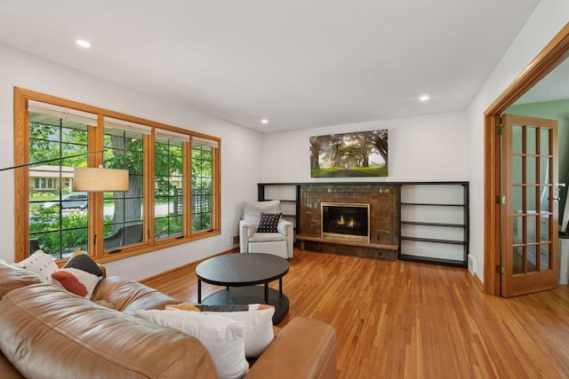 10933 Chowen Ave S, Bloomington, MN 55431 - living area with wood finished floors, a fireplace, recessed lighting, and baseboards