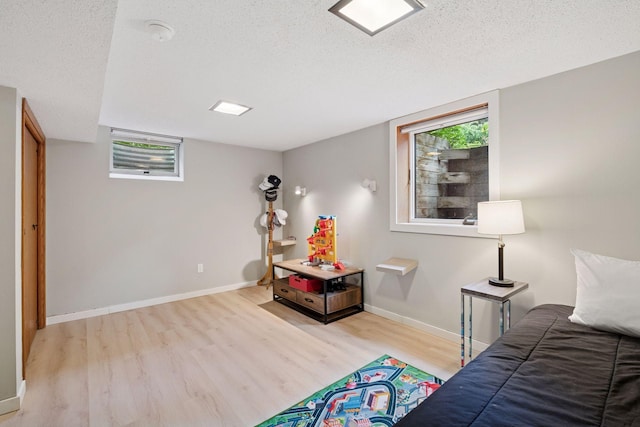 10933 Chowen Ave S, Bloomington, MN 55431 - bedroom with wood finished floors, a textured ceiling, multiple windows, and baseboards