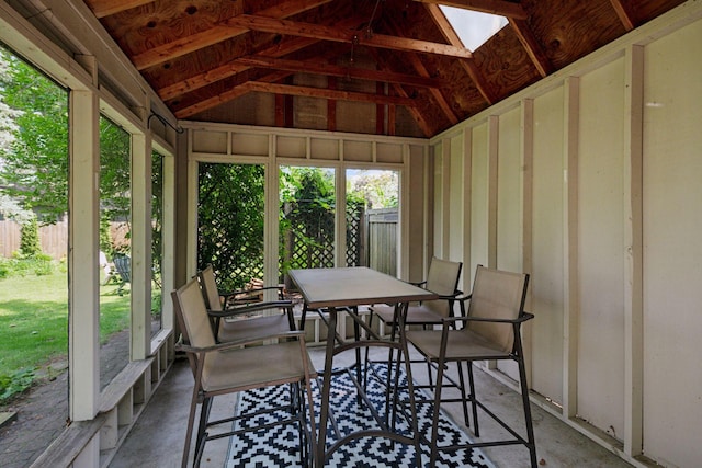 10933 Chowen Ave S, Bloomington, MN 55431 - sunroom / solarium featuring a skylight, plenty of natural light, lofted ceiling, and outdoor dining area