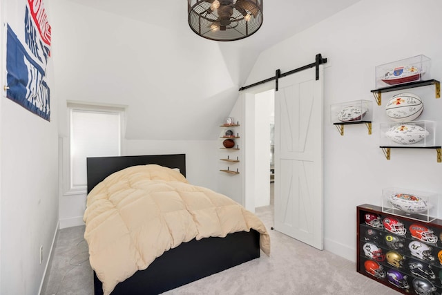 150 1st St, Excelsior, MN 55331 - bedroom featuring vaulted ceiling, carpet flooring, a barn door, and baseboards