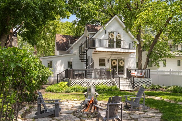 150 1st St, Excelsior, MN 55331 - back of house featuring stairs, a fire pit, a balcony, a shingled roof, and a deck