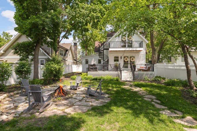150 1st St, Excelsior, MN 55331 - view of yard with a balcony, a fire pit, a wooden deck, and a patio