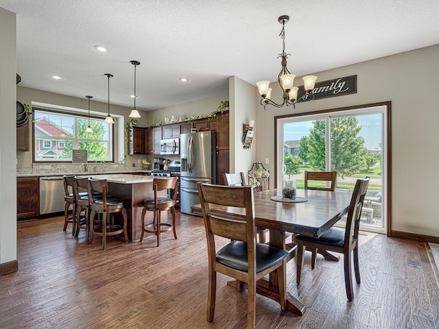 6024 158th St W, Apple Valley, MN 55124 - dining room featuring dark wood-style flooring, a chandelier, recessed lighting, and baseboards