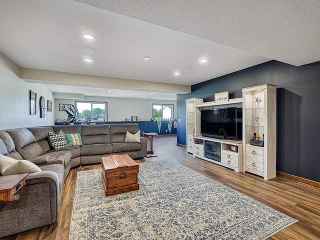 6024 158th St W, Apple Valley, MN 55124 - living area with wood finished floors, recessed lighting, a textured ceiling, and baseboards
