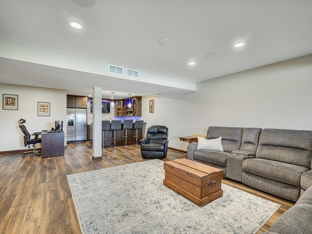 6024 158th St W, Apple Valley, MN 55124 - living room featuring baseboards, bar, dark wood finished floors, an office area, and recessed lighting