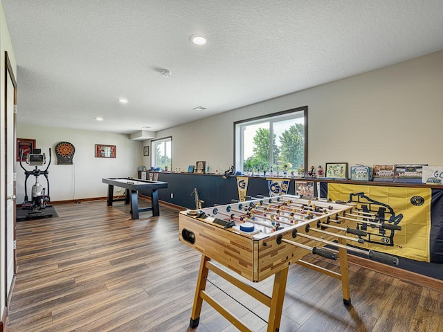 6024 158th St W, Apple Valley, MN 55124 - rec room featuring wood finished floors, recessed lighting, a textured ceiling, and baseboards
