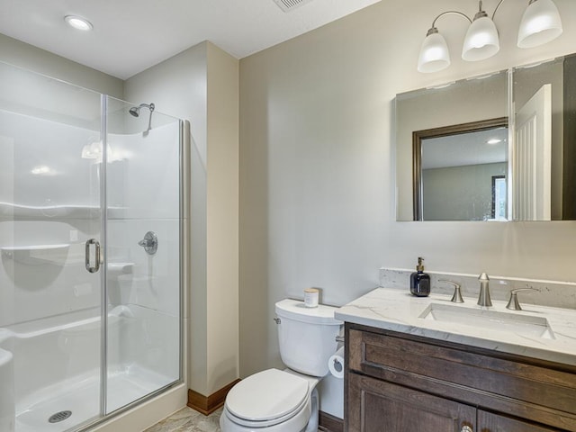 6024 158th St W, Apple Valley, MN 55124 - bathroom with baseboards, toilet, a stall shower, and vanity