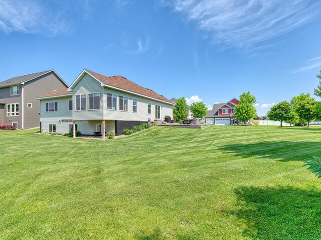 6024 158th St W, Apple Valley, MN 55124 - rear view of house featuring a yard