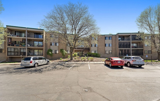 1855 Silver Bell Rd Unit 321, Eagan, MN 55122 - view of apartment building / complex featuring uncovered parking