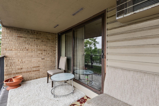 1855 Silver Bell Rd Unit 321, Eagan, MN 55122 - view of patio featuring a balcony