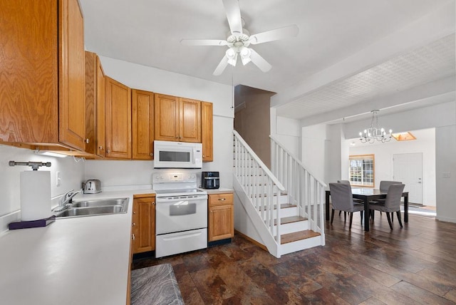 408 State St E, Grey Eagle, MN 56336 - kitchen with white appliances, a sink, a chandelier, light countertops, and ceiling fan