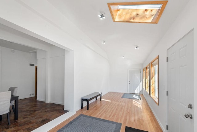 408 State St E, Grey Eagle, MN 56336 - entrance foyer with wood finished floors, lofted ceiling, and baseboards