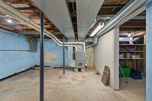 408 State St E, Grey Eagle, MN 56336 - unfinished below grade area featuring heating unit and electric panel