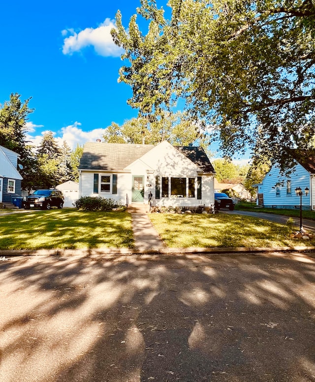 4228 Halifax Ave N, Robbinsdale, MN 55422 - view of front facade featuring a front lawn