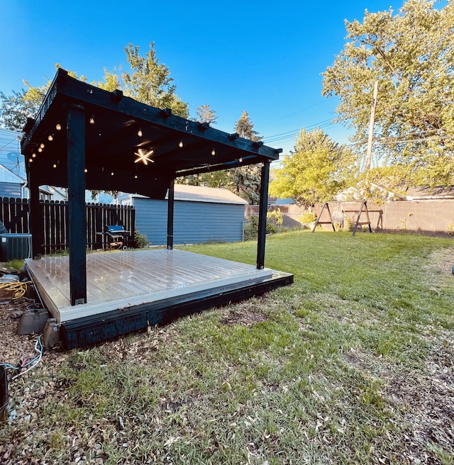 4228 Halifax Ave N, Robbinsdale, MN 55422 - view of yard with a wooden deck, ceiling fan, and cooling unit