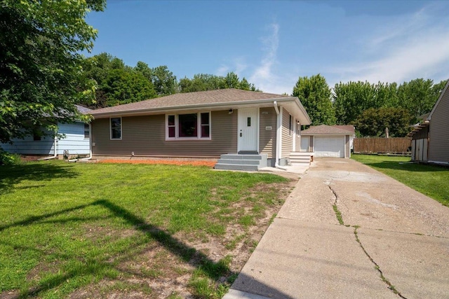 1637 37th Ave NE, Columbia Heights, MN 55421 - view of front of home featuring an outdoor structure, a front yard, and a detached garage