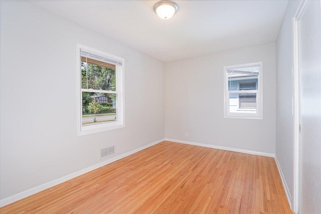 1637 37th Ave NE, Columbia Heights, MN 55421 - spare room with light wood-style floors and baseboards