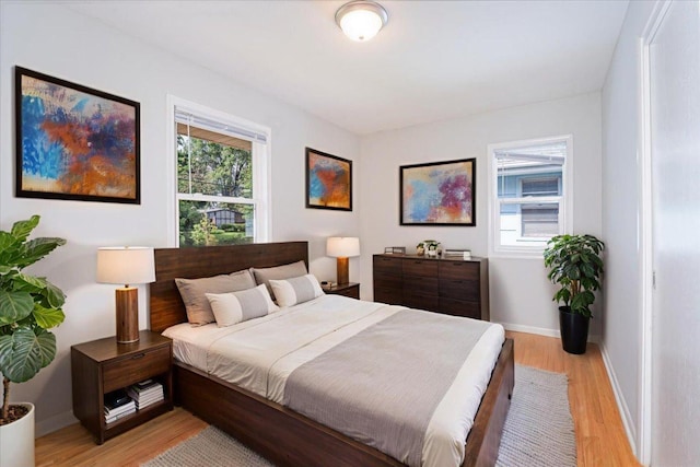 1637 37th Ave NE, Columbia Heights, MN 55421 - bedroom featuring light wood-style floors and baseboards